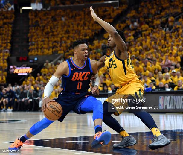 Donovan Mitchell of the Utah Jazz guards against Russell Westbrook of the Oklahoma City Thunder in the first half during Game Six of Round One of the...