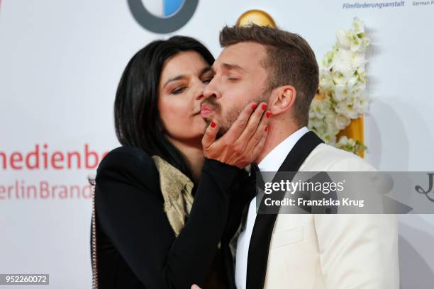 Jasmin Tabatabai and Edin Hasanovic attend the Lola - German Film Award red carpet at Messe Berlin on April 27, 2018 in Berlin, Germany.