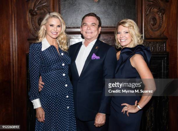 Christie Brinkley, Grant Stevens, and Erin Morrisey pose at a Merz Reception at the annual meeting of the American Society for Aesthetic Plastic...
