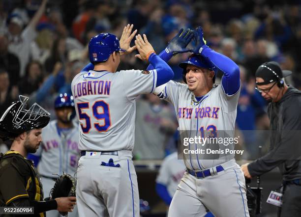 Asdrubal Cabrera of the New York Mets is congratulated by Jose Lobaton of the New York Mets after hitting a three-run home run during the seventh...