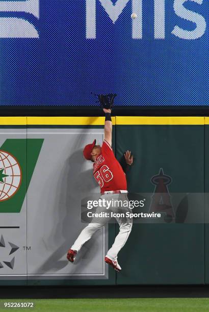 Los Angeles Angels of Anaheim right fielder Kole Calhoun takes away a home run from New York Yankees first baseman Neil Walker in the sixth inning of...