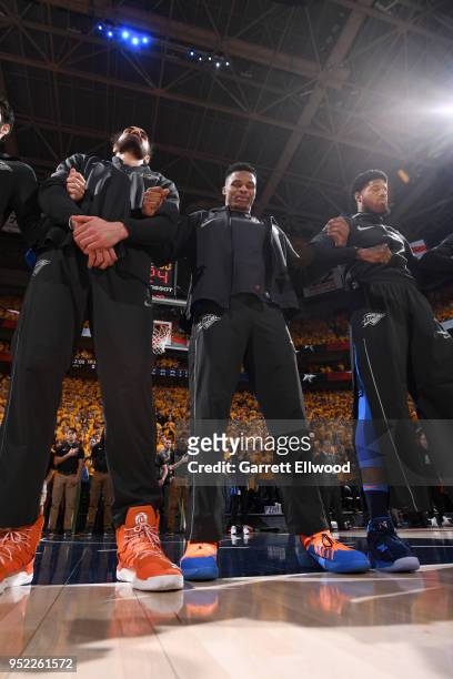 Alex Abrines, Steven Adams, Russell Westbrook, and Paul George of the Oklahoma City Thunder stand for the National Anthem before Game Six of the...