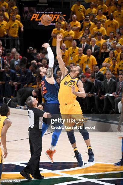 Steven Adams of the Oklahoma City Thunder and Rudy Gobert of the Utah Jazz jump for the opening tip-off in Game Six of the Western Conference...