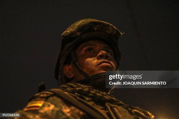 Soldier stands guard at the Comuna 13 neighbourhood in Medellin, Antioquia Department, Colombia, on April 27, 2018. - The Comuna 13 neighbourhood was...