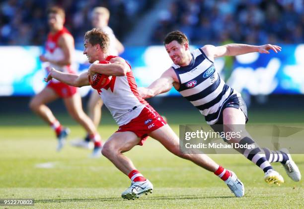 Kieren Jack of the Swans runs with the ball from Patrick Dangerfield of the Cats during the round six AFL match between the Geelong Cats and Sydney...