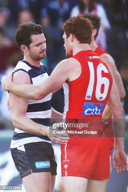 Patrick Dangerfield of the Cats looks dejected after defeat with Gary Rohan of the Swans during the round six AFL match between the Geelong Cats and...