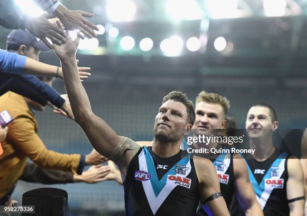 Brad Ebert of the Power high fives fans after winning the round six AFL match between the North Melbourne Kangaroos and Port Adelaide Power at Etihad...