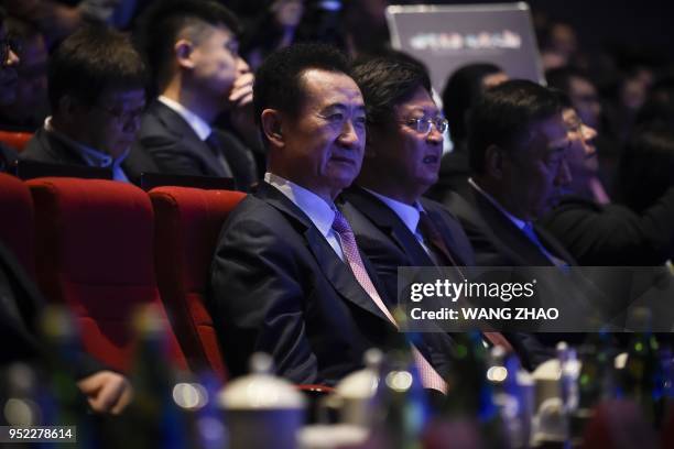 Chairman of China's Wanda Group Wang Jianlin attends the opening ceremony of Wanda Qingdao Movie Metropolis in Qingdao, China's Shandong province on...