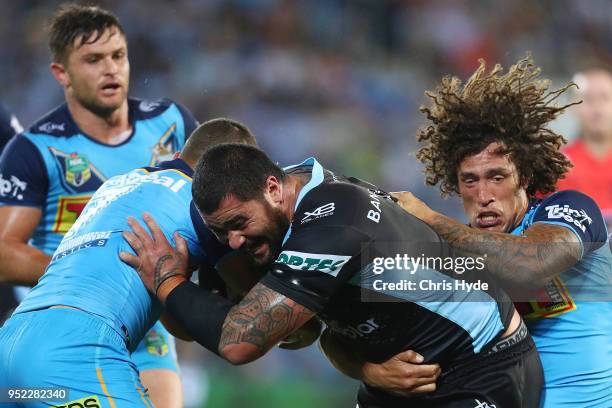 Andrew Fifita of the Sharks is tackled during the round eight NRL match between the Gold Coast Titans and Cronulla Sharks at Cbus Super Stadium on...