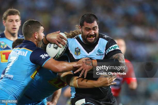 Andrew Fifita of the Sharks is tackled during the round eight NRL match between the Gold Coast Titans and Cronulla Sharks at Cbus Super Stadium on...