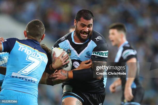 Andrew Fifita of the Sharks is tackled during the round eight NRL match between the Gold Coast Titans and Cronulla Sharks at Cbus Super Stadium on...