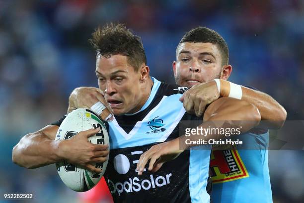 Scott Sorensen of the Sharks is tackled by Ash Taylor of the Titans during the round eight NRL match between the Gold Coast Titans and Cronulla...