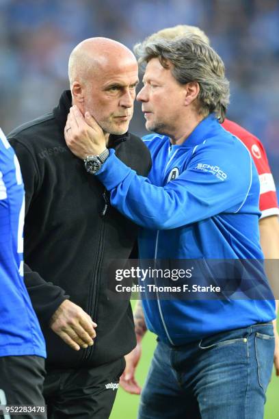 Head coach Jeff Saibene of Bielefeld comforts head coach Michael Frontzeck of Kaiserslautern after the Second Bundesliga match between DSC Arminia...