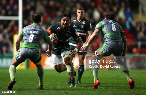 Manu Tuilagi of Leicester Tigers takes on Micky Young and Aly Hogg during the Aviva Premiership match between Leicester Tigers and Newcastle Falcons...