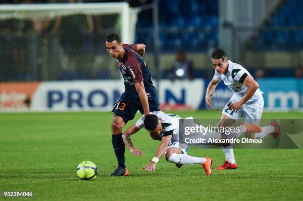 Ellyes Skhiri of Montpellier and Remy Cabella and Romain Hamouma of Saint Etienne during the Ligue 1 match between Montpellier Herault SC and AS...