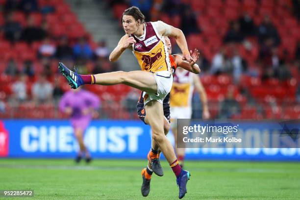 Eric Hipwood of the Lions kicks a goal during the round six AFL match between the Greater Western Sydney Giants and the Brisbane Lions at Spotless...