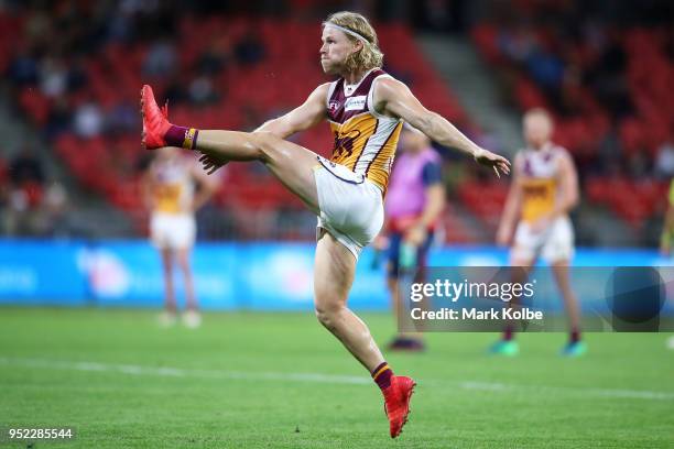 Daniel Rich of the Lions kicks at goal during the round six AFL match between the Greater Western Sydney Giants and the Brisbane Lions at Spotless...