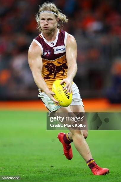 Daniel Rich of the Lions shapes to kick during the round six AFL match between the Greater Western Sydney Giants and the Brisbane Lions at Spotless...