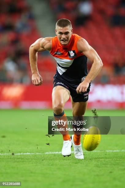 Adam Tomlinson of the Giants runs for the ball during the round six AFL match between the Greater Western Sydney Giants and the Brisbane Lions at...