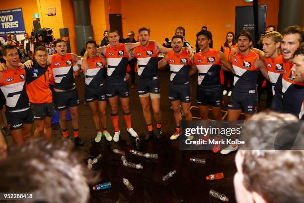 The Giants sing their team song as they celebrate victory after the round six AFL match between the Greater Western Sydney Giants and the Brisbane...