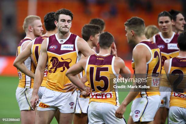 The Lions look dejected after defeat during the round six AFL match between the Greater Western Sydney Giants and the Brisbane Lions at Spotless...