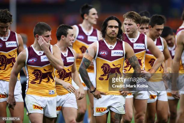 Allen Christensen of the Lions and his team mates look dejected after defeat during the round six AFL match between the Greater Western Sydney Giants...