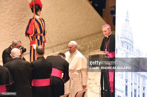 Pope Francis smiles as he welcomes participants at "Unite To Cure, A Global Health Care Initiative, during his audience at Aula Paolo VI in The...