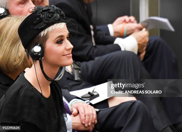 Singer Katheryn Elizabeth Hudson, known professionally as Katy Perry looks towards an unseen Pope Francis as he welcomes participants at "Unite To...