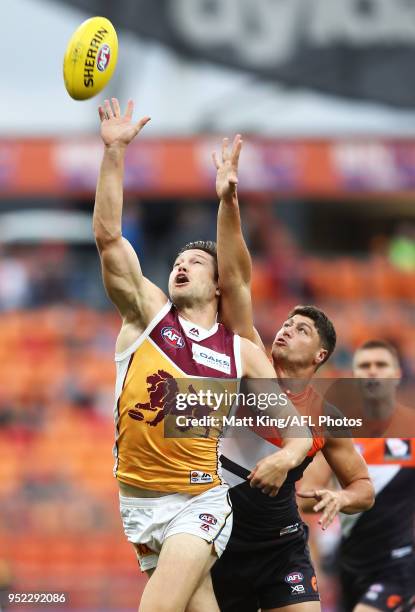 Stefan Martin of the Lions is challenged by Jonathon Patton of the Giants during the round six AFL match between the Greater Western Sydney Giants...