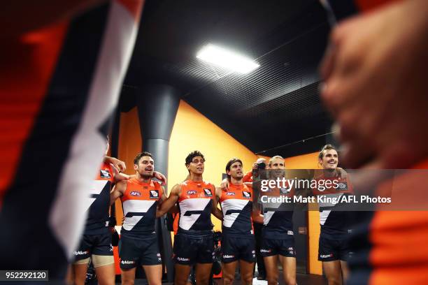Stephen Coniglio, Nick Shipley, Ryan Griffen, Nick Haynes and Phil Davis of the Giants celebrate victory and sing the club song after the round six...