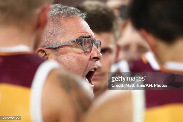 Lions coach Chris Fagan speaks to players at three quarter time during the round six AFL match between the Greater Western Sydney Giants and the...
