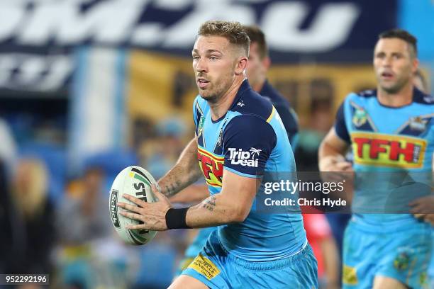 Bryce Cartwright of the Titans runs the ball during the round eight NRL match between the Gold Coast Titans and Cronulla Sharks at Cbus Super Stadium...
