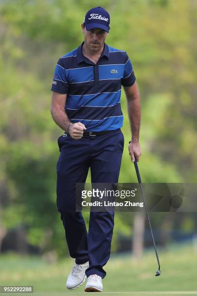 Julien Guerrier of France reacts after the plays a shot during the day three of the 2018 Volvo China Open at Topwin Golf and Country Club on April...