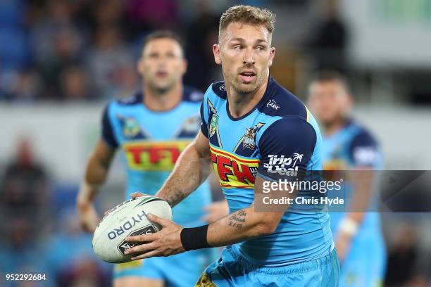Bryce Cartwright of the Titans runs the ball during the round eight NRL match between the Gold Coast Titans and Cronulla Sharks at Cbus Super Stadium...