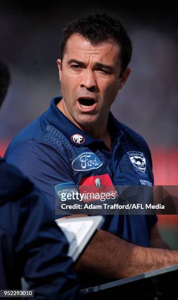 Chris Scott, Senior Coach of the Cats looks on during the 2018 AFL round six match between the Geelong Cats and the Sydney Swans at GMHBA Stadium on...