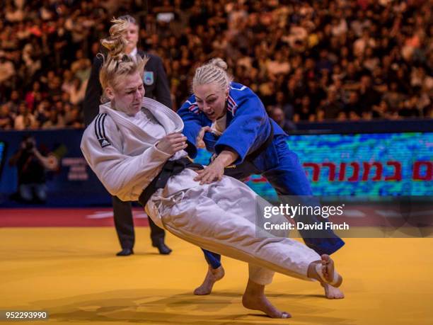 Rio Olympic medallist, Sally Conway of Great Britain sweeps the legs from under Kim Polling of the Netherlands to score a wazari in the u70kg final...