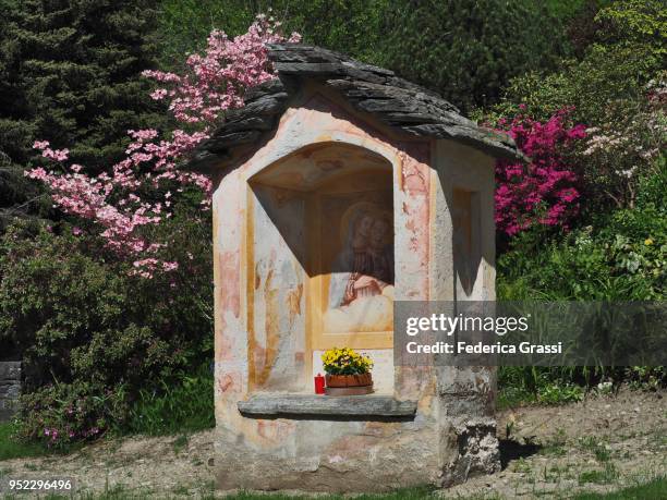 small chapel surrounded by flowers in maggia valley, switzerland - giumaglio stock pictures, royalty-free photos & images