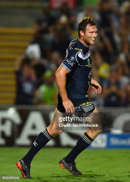 Gavin Cooper of the Cowboys celebrates after scoring a try during the round eight NRL match between the North Queensland Cowboys and the Canberra...