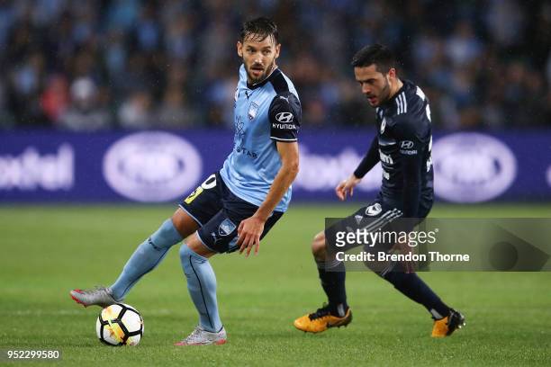 Milos Ninkovic of Sydney competes with Kosta Barbarouses of the Victory during the A-League Semi Final match between Sydney FC and Melbourne Victory...