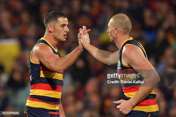 Taylor Walker of the Crows and Sam Jacobs of the Crows celebrate during the round six AFL match between the Adelaide Crows and Gold Coast Suns at...