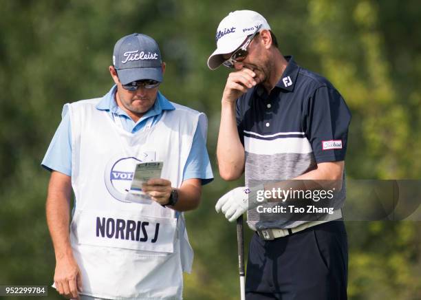 Jason Norris of Australia talks with his mate during the third round of the 2018 Volvo China open at Beijing Huairou Topwin Golf and Country Club?on...