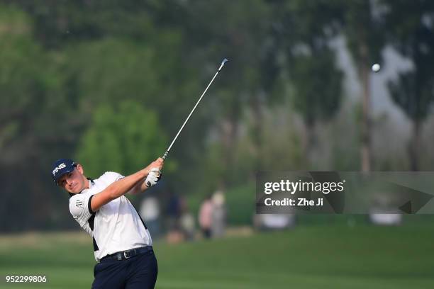 Matt Wallace of England plays a shot during the day three of the 2018 Volvo China Open at Topwin Golf and Country Club on April 28, 2018 in Beijing,...