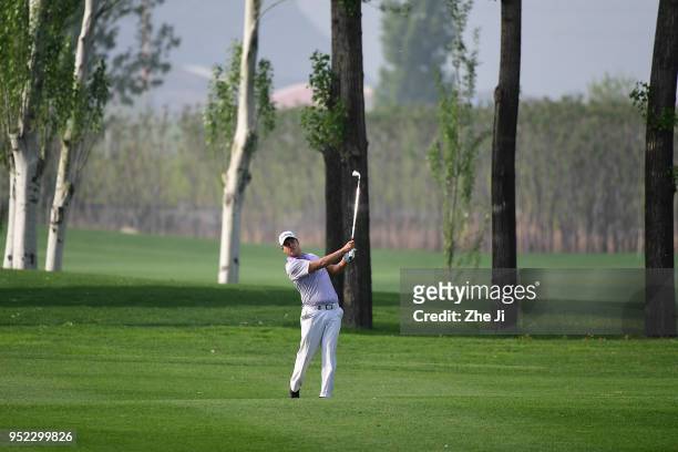 Sihwan Kim of The United States plays a shot during the day three of the 2018 Volvo China Open at Topwin Golf and Country Club on April 28, 2018 in...