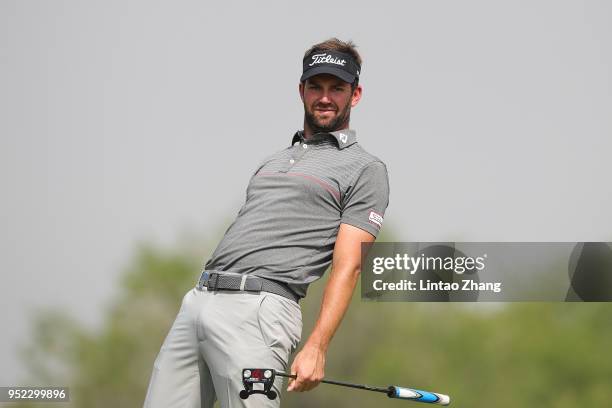 Scott Jamieson of Scotland reacts after the plays a shot during the day three of the 2018 Volvo China Open at Topwin Golf and Country Club on April...