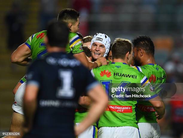 The Raiders celebrate the try of Aidan Sezer of the Raiders during the round eight NRL match between the North Queensland Cowboys and the Canberra...
