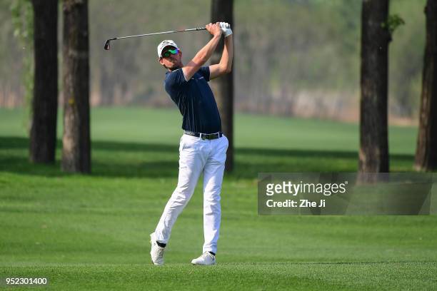 Alexander Bjork of Sweden plays a shot during the day three of the 2018 Volvo China Open at Topwin Golf and Country Club on April 28, 2018 in...