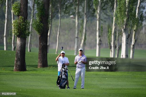 Sihwan Kim of The United States plays a shot during the day three of the 2018 Volvo China Open at Topwin Golf and Country Club on April 28, 2018 in...