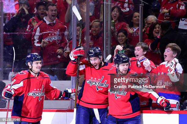 Evgeny Kuznetsov of the Washington Capitals celebrates with his teammates after scoring a first period goal against the Pittsburgh Penguins in Game...