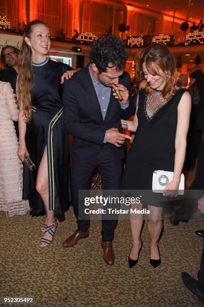 Pheline Roggan, Fahri Yardim and Lavinia Wilson attend the Lola - German Film Award party at Palais am Funkturm on April 27, 2018 in Berlin, Germany.