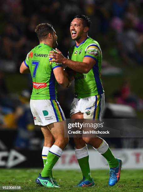 Aidan Sezer of the Raiders and Jordan Rapana of the Raiders celebrate after winning the round eight NRL match between the North Queensland Cowboys...
